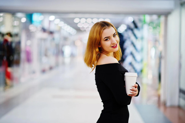 fashion-red-haired-girl-wear-on-black-dress-with-bright-make-holding-coffee-cup-at-trade-shopping-center-photo-toned-style-instagram-filters_627829-11436